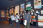 ２０周年を記念したポスター展示＝１３日、鹿児島市の鹿児島ミッテ１０