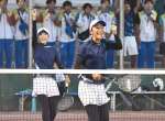成年女子２回戦、得点を決め喜ぶ鹿児島の山本（手前）と末吉＝唐津市松浦河畔公園庭球場