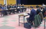 県地域防災計画の修正案を了承した県防災会議＝２１日、鹿児島県庁
