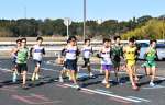 １０キロ走で競う鹿児島チームの選手＝北部清掃工場