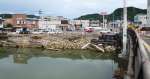 大雨の影響で崩れた網掛橋の護岸＝２０日、姶良市加治木の国道１０号網掛橋